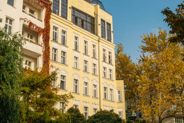 istock modern apartments framed by ivy and trees in autumn colors 867704530
