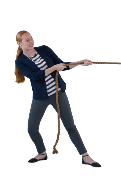 istock Businesswoman pulling the rope against white background 867705296