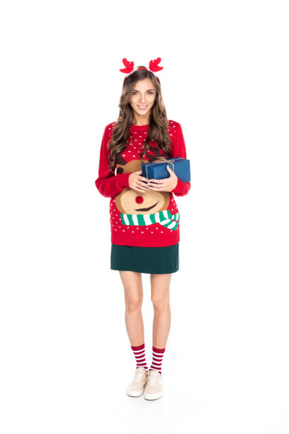 istock woman holding christmas gift 867707736