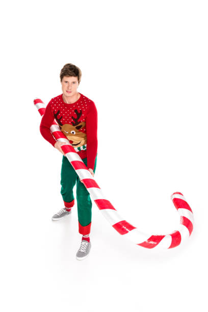 istock man with christmas decorative lollipop 867712444