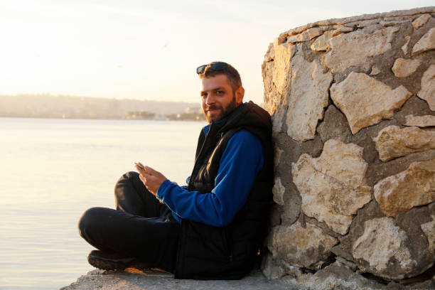 istock Mobile smartphone in man's hands near the sea 867717102