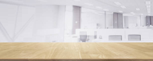 istock Wood table top and blurred bokeh office interior space background - can used for display or montage your products. 867720456