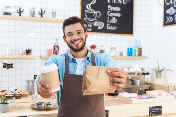 istock barista with coffee to go 867720852