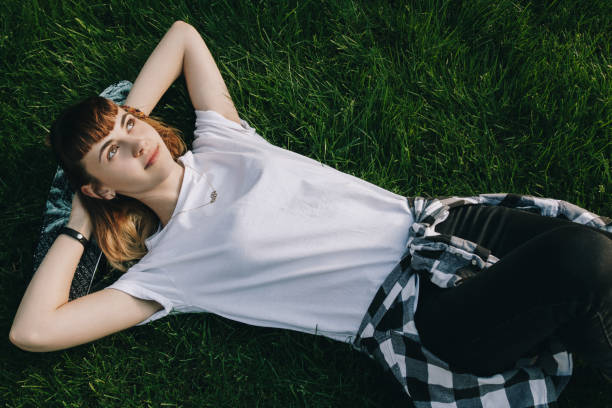 istock Hipster girl relaxing on the grass 867723104