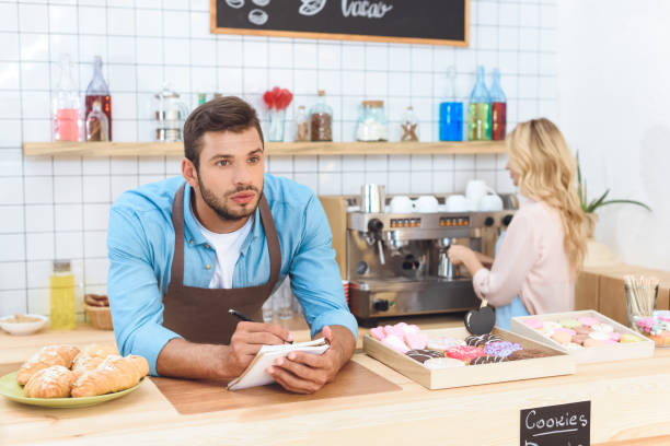 istock couple working together in cafe 867723328
