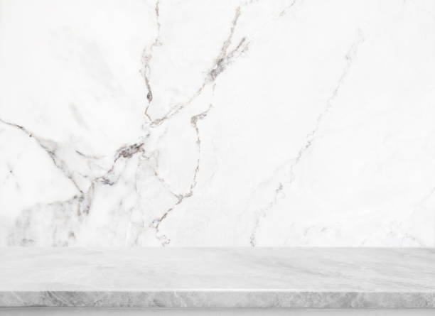 istock White stone table top and background of white marble stone wall - can used for display or montage your products. 867727146