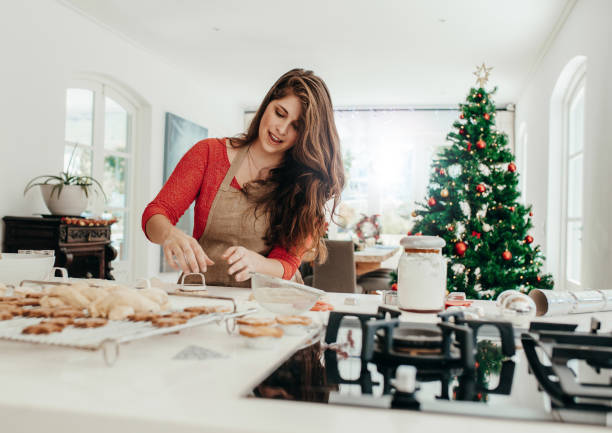istock Woman preparing cookies for Christmas. 867727160