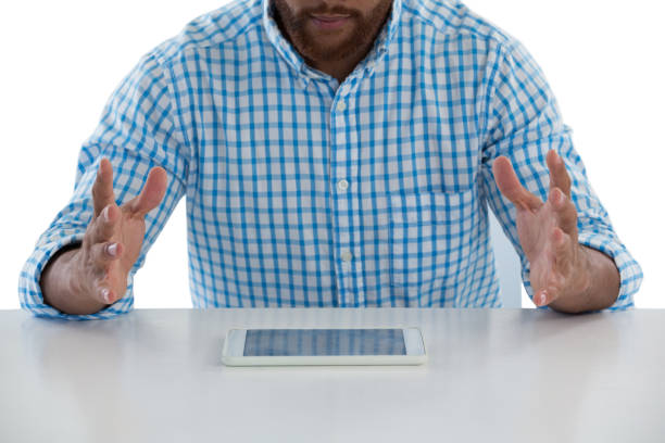 istock Male executive trying to hold the digital tablet 867727200