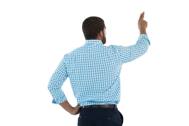 istock Male executive pretending to use an invisible screen 867727254