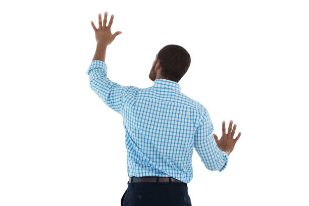 istock Male executive pretending to use an invisible screen 867727264