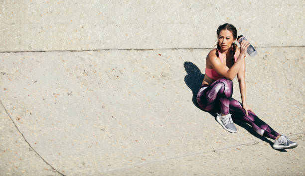 istock Fitness woman relaxing after workout session 867730382
