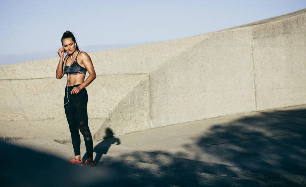 istock Sportswoman taking break from fitness workout 867730432