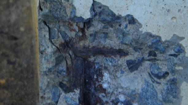 istock rusty steel showing on a broken reinforced concrete beam 867736984