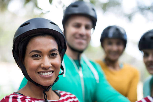 istock Friends enjoying zip line adventure in park 867739604