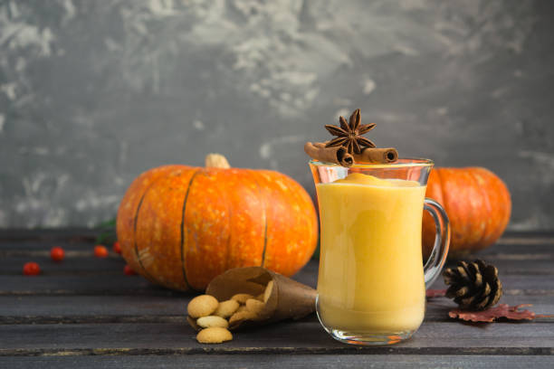 istock Breakfast sweet pumpkin smoothie with cookies on grey background 867742312