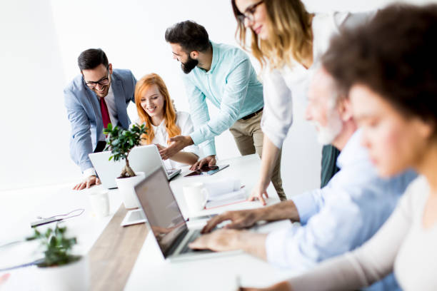 istock Joyful multiracial business team at work in modern office 867742818