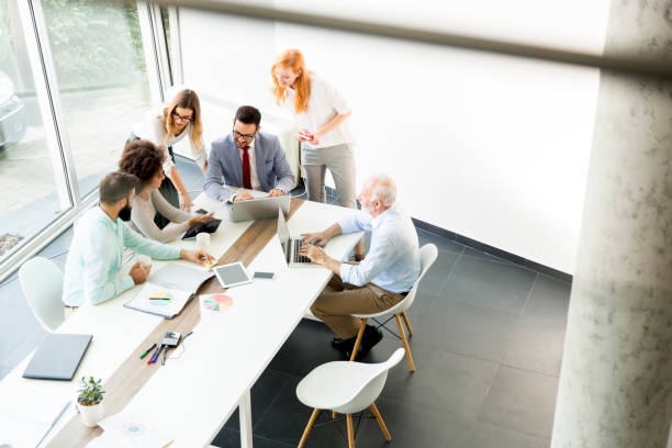 istock Joyful multiracial business team at work in modern office 867742860