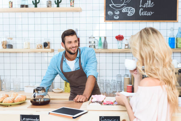 istock barista and woman in cafe 867743086