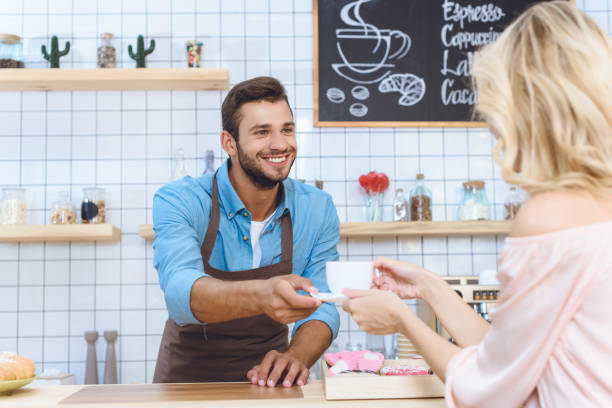 istock barista giving coffee to client 867745276