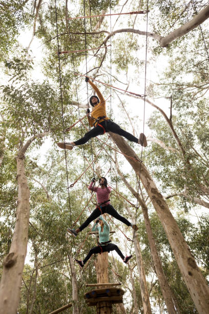 istock Friends on zipline in adventure park 867745358