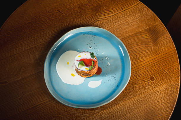 istock plate with tasty pancakes on wooden table 867746436