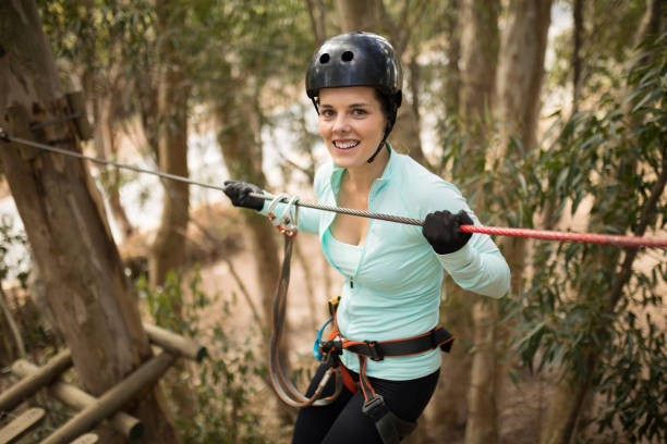 istock Woman on zipline in adventure park 867747554