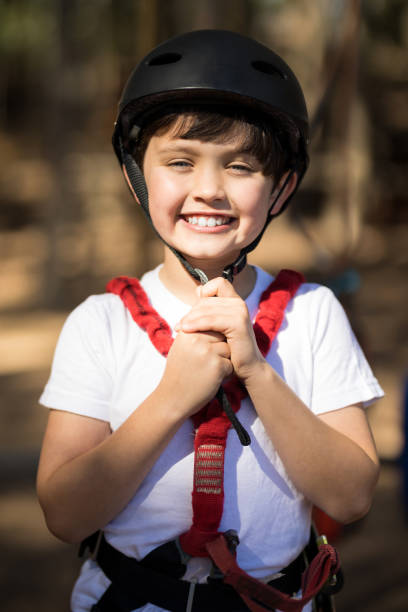 istock Boy wearing his helmet in park 867747736