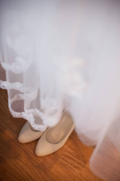 istock bride's shoes under the dress 867758174