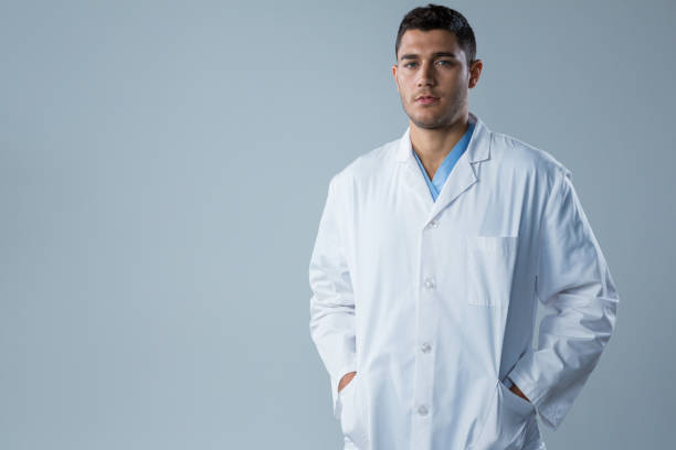 istock Doctor standing with his hands in pockets 867764550