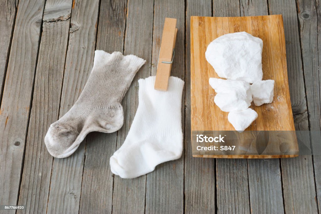 Washing washing chemicals with dirty and clean socks Backgrounds Stock Photo