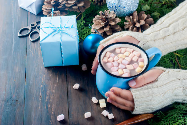 istock little girl holds hot chocolate mug wit marshmallow 867767230