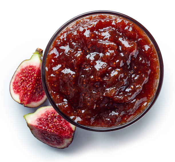Bowl of fig jam Bowl of fig jam isolated on white background from top view chutney stock pictures, royalty-free photos & images