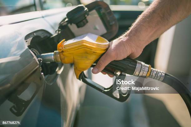 Car Refueling On Petrol Station Man Pumping Gasoline Oil This Photo Can Be Used For Automotive Industry Or Transportation Concept Stock Photo - Download Image Now