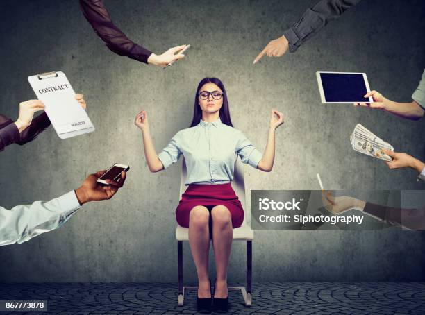 Young Business Woman Is Meditating To Relieve Stress Of Busy Corporate Life Stock Photo - Download Image Now