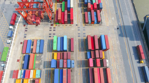 istock Logistics and transportation of Container Cargo ship and Cargo working crane bridge in shipyard 867774550