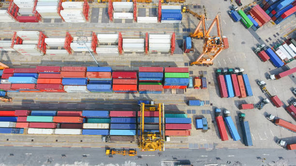 istock Logistics and transportation of Container Cargo ship and Cargo working crane bridge in shipyard 867774822