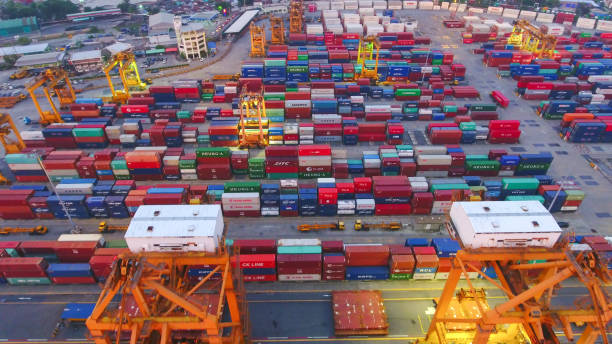 istock Logistics and transportation of Container Cargo ship and Cargo working crane bridge in shipyard 867774846