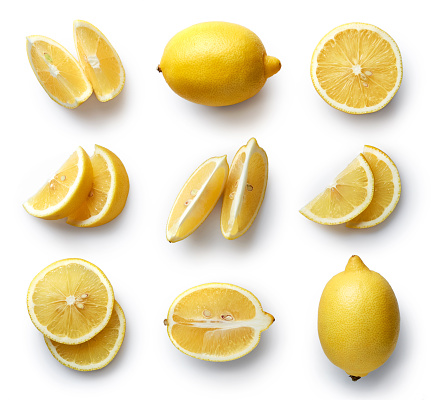 Set of fresh whole and cut lemon and slices isolated on white background. From top view