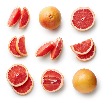 Set of fresh whole and cut grapefruit and slices isolated on white background. From top view