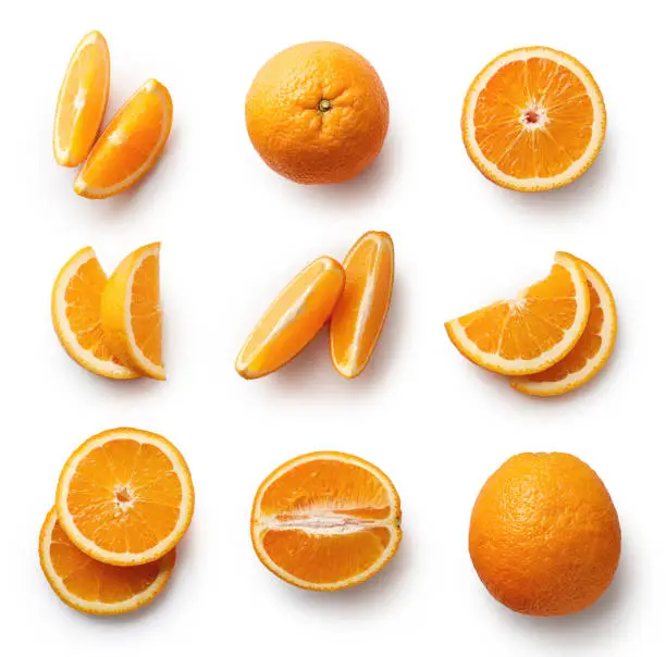 Set of fresh whole and cut orange and slices isolated on white background. From top view