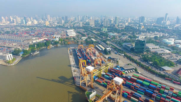 istock Logistics and transportation of Container Cargo ship and Cargo working crane bridge in shipyard 867775150