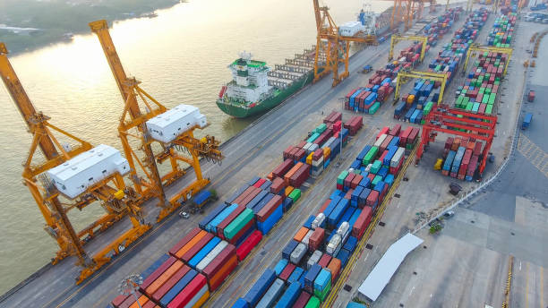 istock Logistics and transportation of Container Cargo ship and Cargo working crane bridge in shipyard 867775288