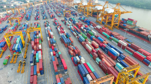 istock Logistics and transportation of Container Cargo ship and Cargo working crane bridge in shipyard 867775332