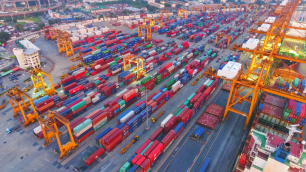 istock Logistics and transportation of Container Cargo ship and Cargo working crane bridge in shipyard 867775482