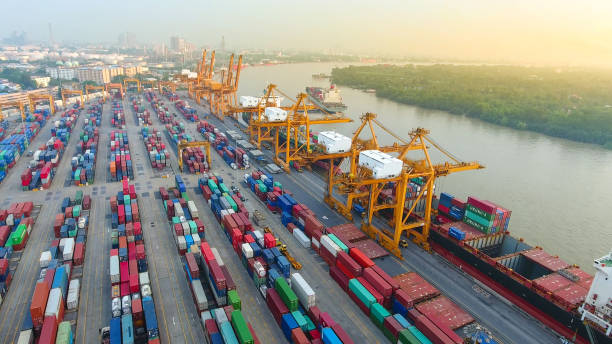 istock Logistics and transportation of Container Cargo ship and Cargo working crane bridge in shipyard 867775528