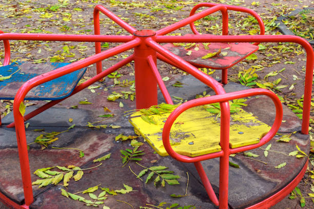 istock red carousel on the playground in autumn 867791762