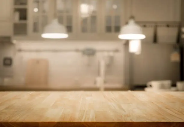 Photo of Wood table top on blur kitchen wall room background