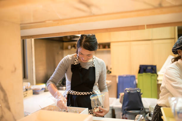 Professional female chef preparing for social party