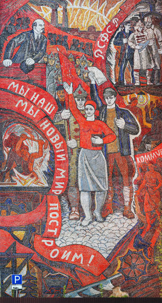 Mosaic of the Soviet era on the facade of a public building, publicly available, completed in 1969. Artist Y. Dehto. Sots Art. Lenin, RSFSR, International, "We will build our new world" Naro-Fominsk, Russia - May, 2017: Mosaic of the Soviet era on the facade of a public building, completed in 1969. Artist Y. Dehto. Sots Art. Lenin, RSFSR, International,  "We will build our new world" vladimir lenin photos stock pictures, royalty-free photos & images