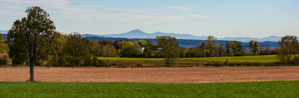 banner landscape of farm with fall foliage